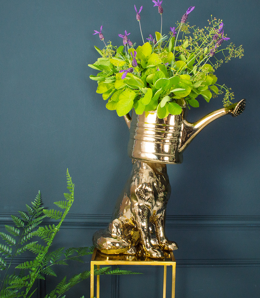 Who doesn't need a vase that's a dog with a watering can on his head?!