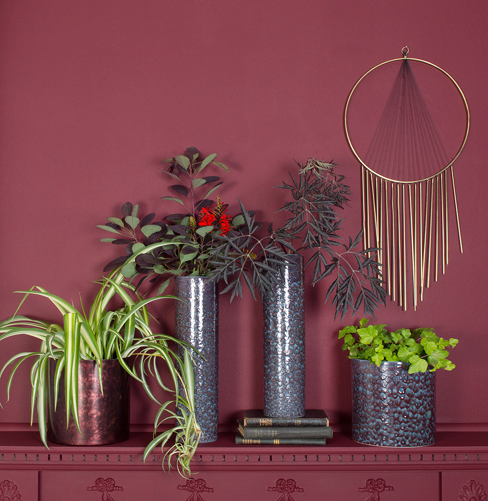 Group different sizes and shapes of house plants and plant pots for a stunning display. 