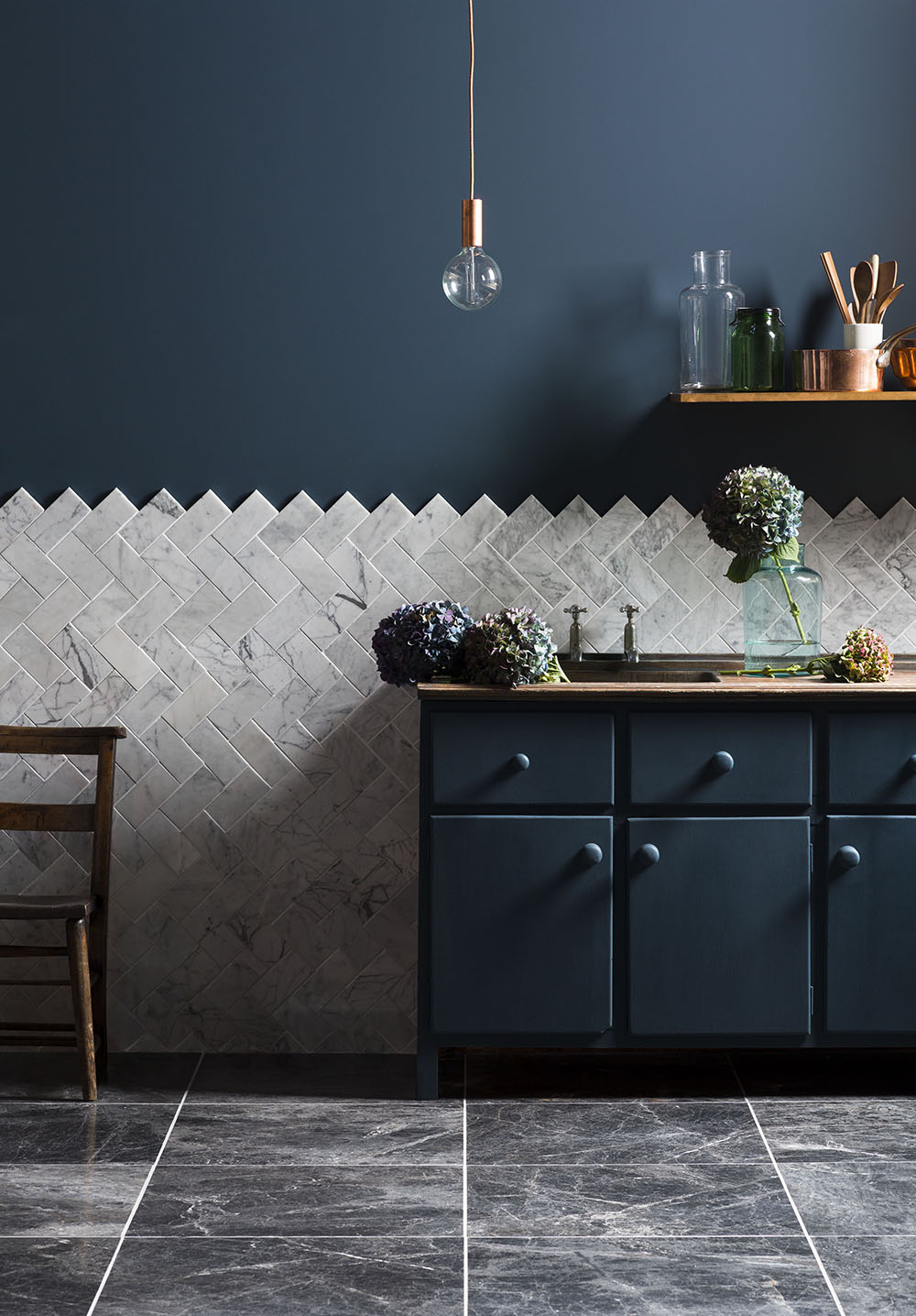 These simple tiles by Mandarin Stone are a good backdrop to any scheme, but in a herring bone pattern they really shout different. 