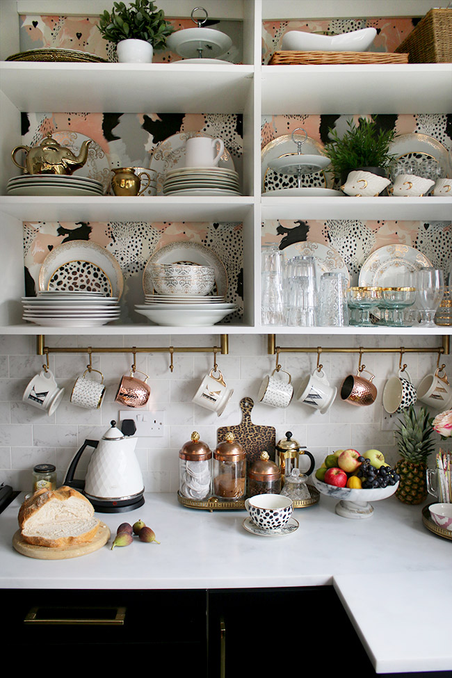 5 Tips for Incorporating Bold Wallpapers in your Home - Use bold, patterned wallpaper behind open shelves to add drama to a room, without going crazy. This stunning kitchen is Kimberly’s of Swoon Worthy, and the wallpaper is by 17 patterns. 