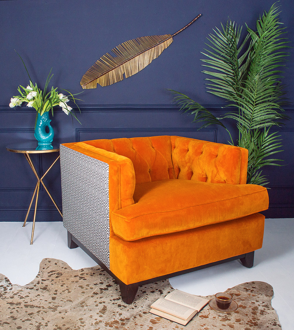 Vibrant jewelled orange in a luxurious soft touch velvet, with the back of the chair in a geometric black and white design for a touch of contrast. The Sumptuous Deep Button Armchair is perfect for brightening up any style of décor and bringing some charisma to a room.