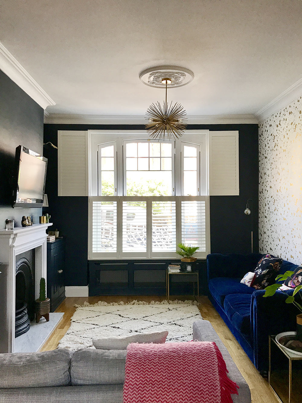 After: Living room makeover. This room has been transformed into a contemporary living room with plenty of glam, gold home accessories.