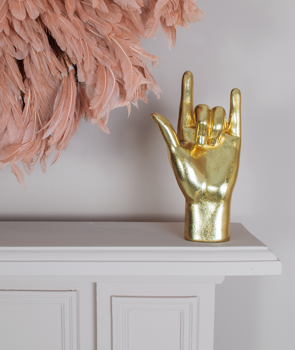 Gold decor styling tips. Accessories are a great way to add subtle touches of gold to your interior. The ‘rock on’ hand is trendy and fun for a discreet touch of gold to your interior. 