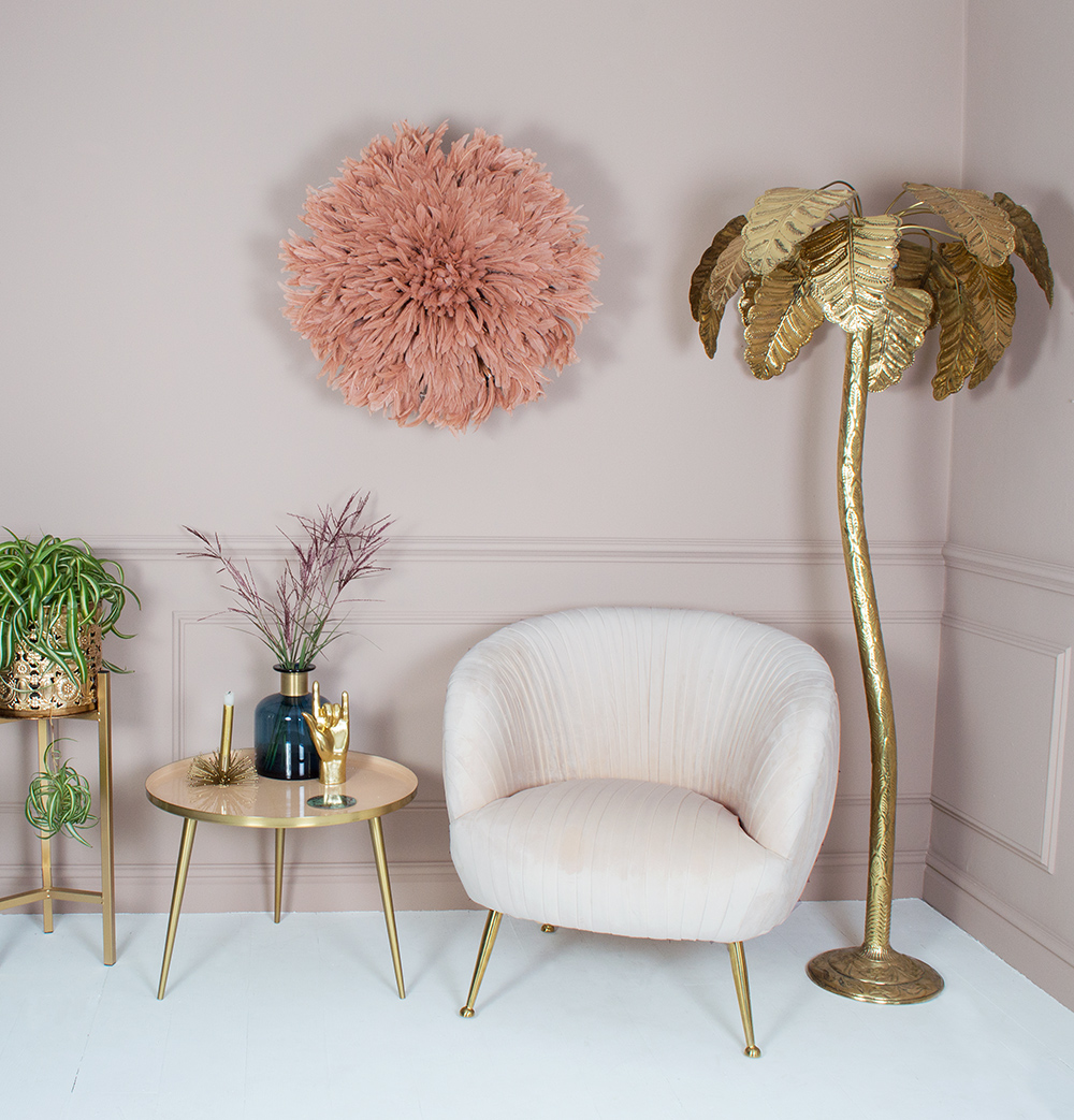 Gold decor styling tips. Accentuate your home decor with stylish accents, like this lavish gold palm tree floor lamp and feather juju hat wall decor.
