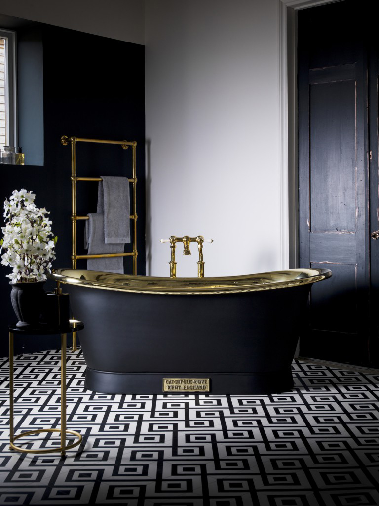 Can it get more lavish than this? Escape and relax in this gorgeous black and gold Brass Bateau Bath by Catchpole & Rye. 