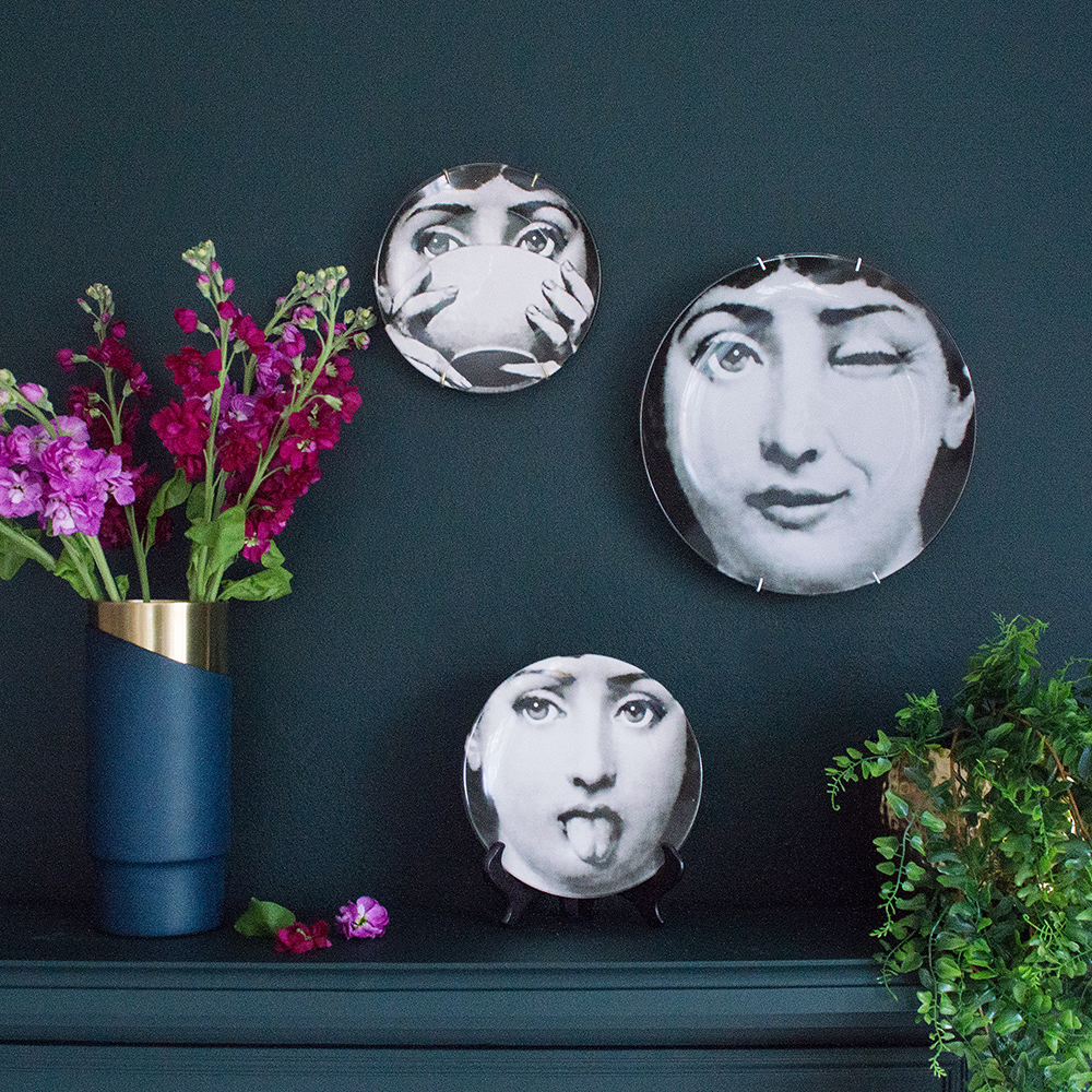 Audenza- Top 10 Cool Homewares Under £50. Stylish and cheeky fornasetti style face plates. Perfect for special occasions or use as a quirky wall decoration.