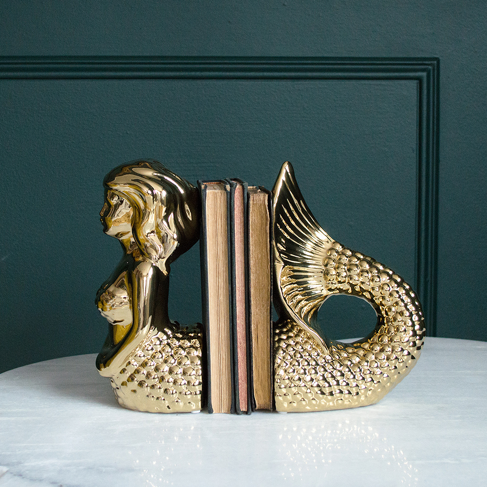 Audenza- Top 10 Cool Homewares Under £50. Lavish gold mermaid bookends.
