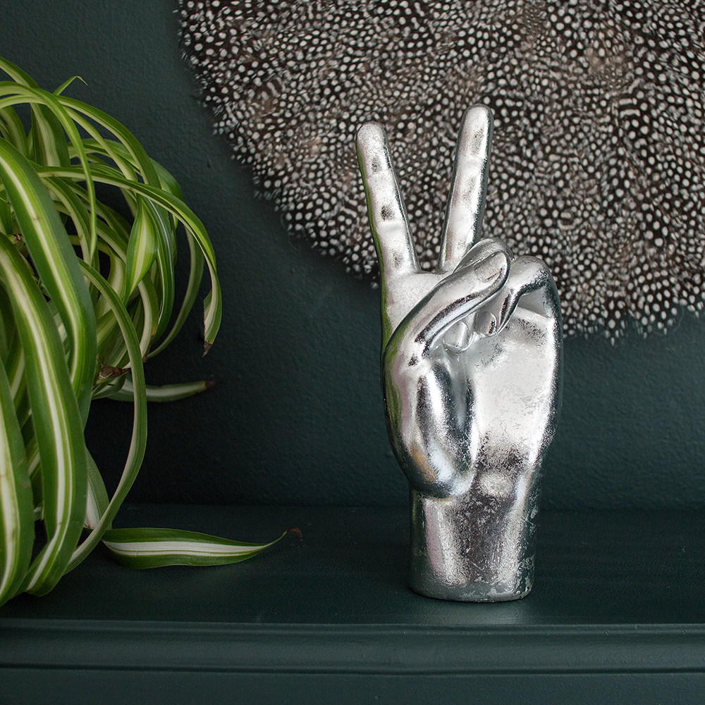 Audenza- Top 10 Cool Homewares Under £50. Decorative silver 'peace' hand.
