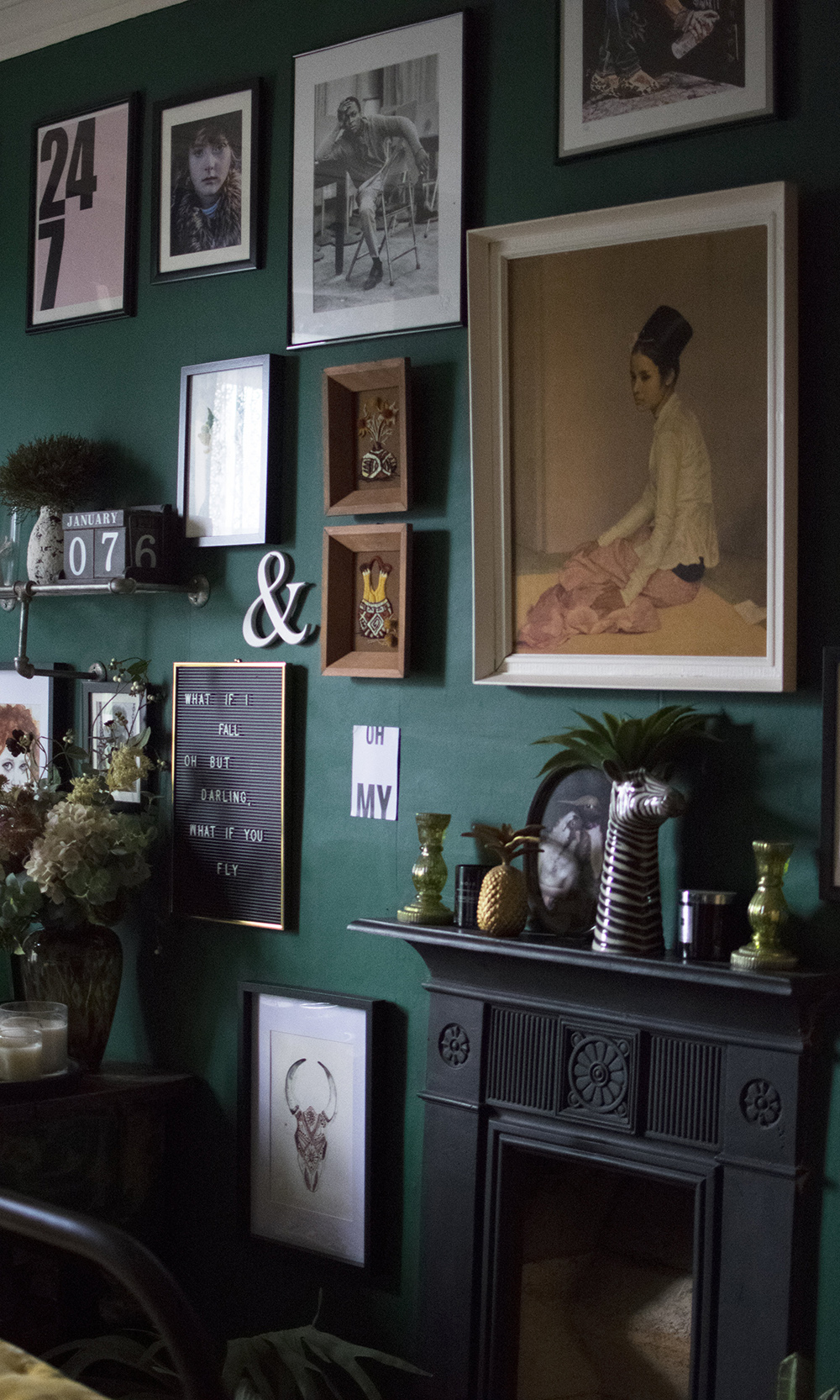 The Girl with the Green Sofa. Dark and moody interiors. Green gallery wall inspiration.