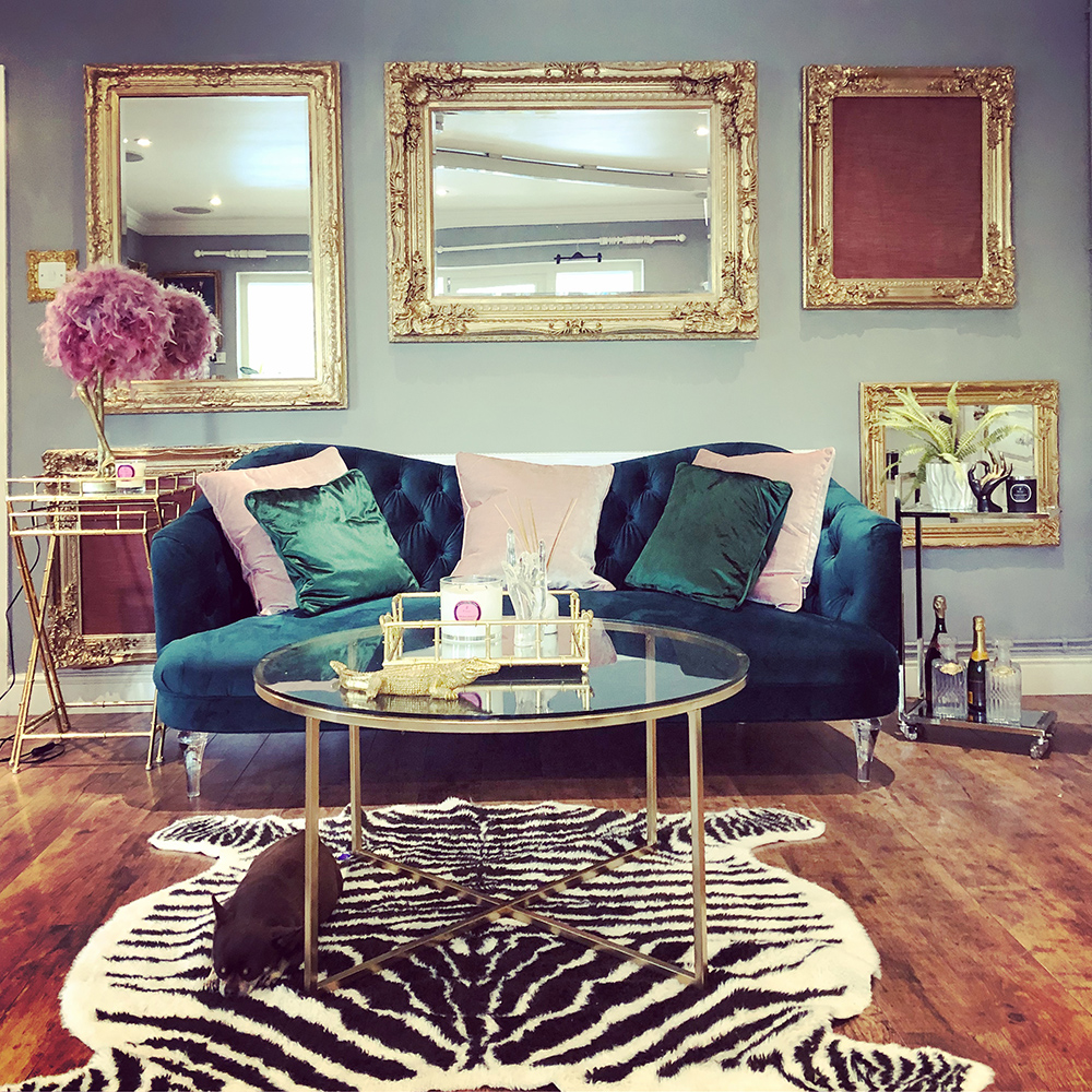 House tour- opulent and eccentric décor. Glam, gold living room with velvet sofa and zebra rug.