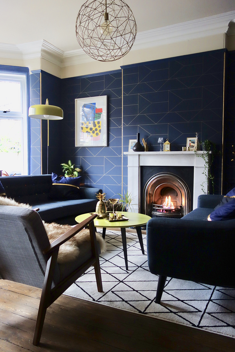 Geometric navy blue wallpaper in a contemporary living room.