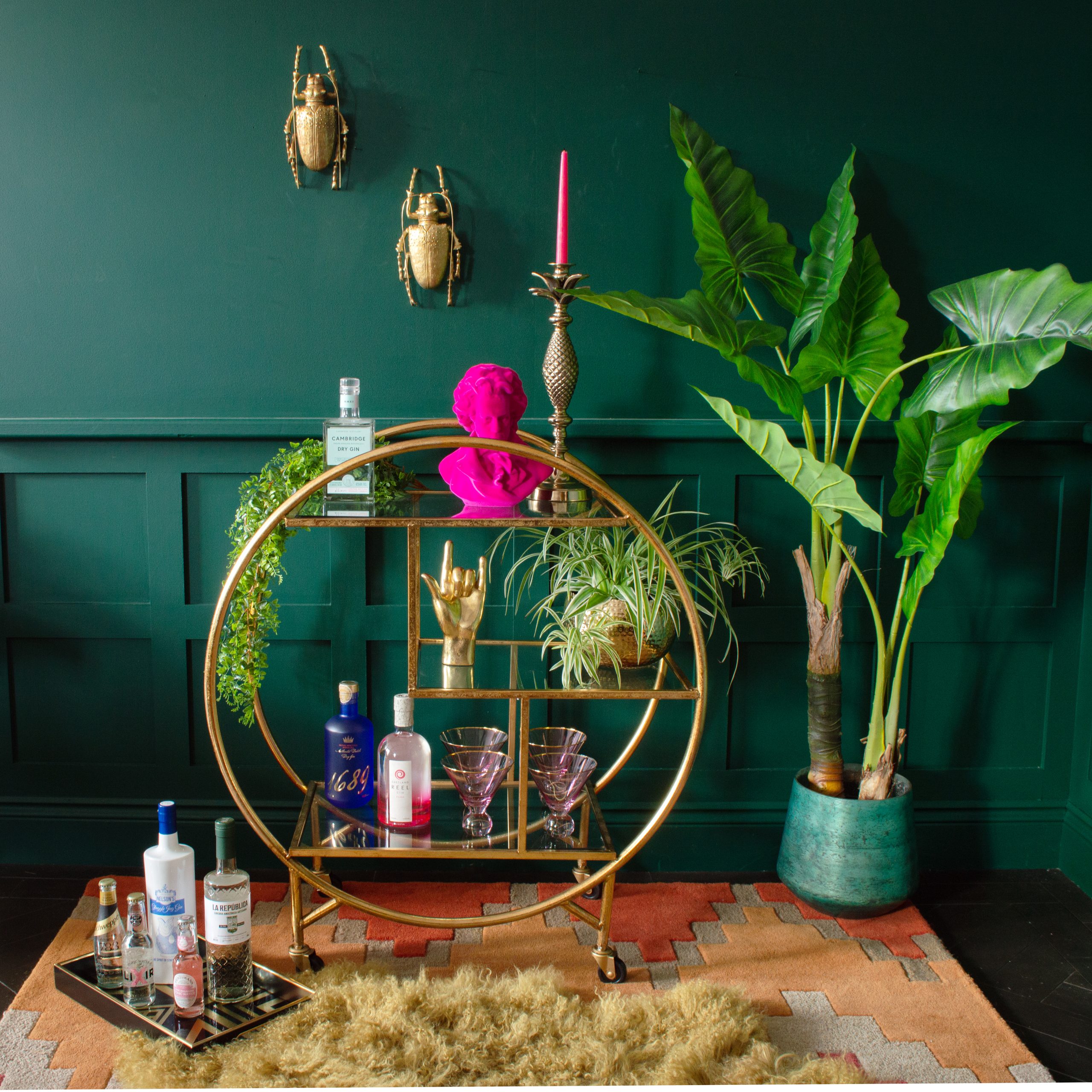 Styling tips for your drinks trolley - Add plenty of plants, unusual glassware, decorative alcohol bottles and quirky beetle wall decor.