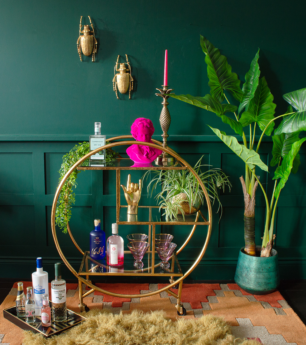 Styling tips for your drinks trolley - Add plenty of plants, unusual glassware, decorative alcohol bottles and quirky beetle wall decor.
