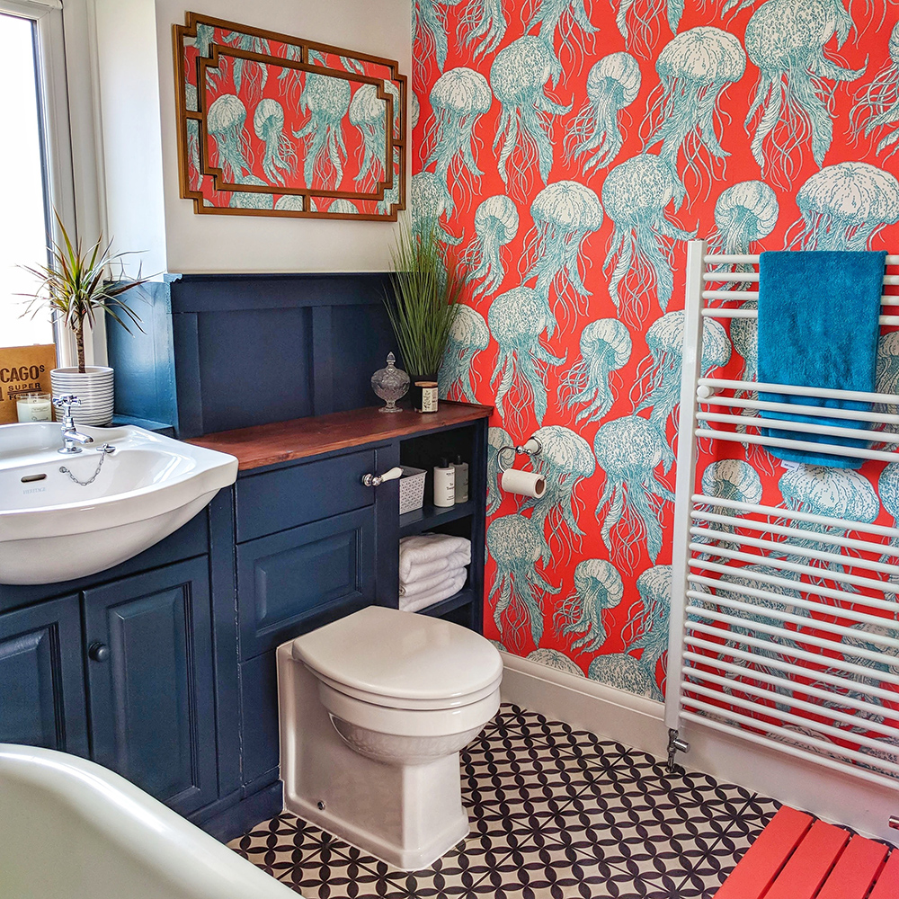 Colourful family bathroom with red jelly fish wallpaper