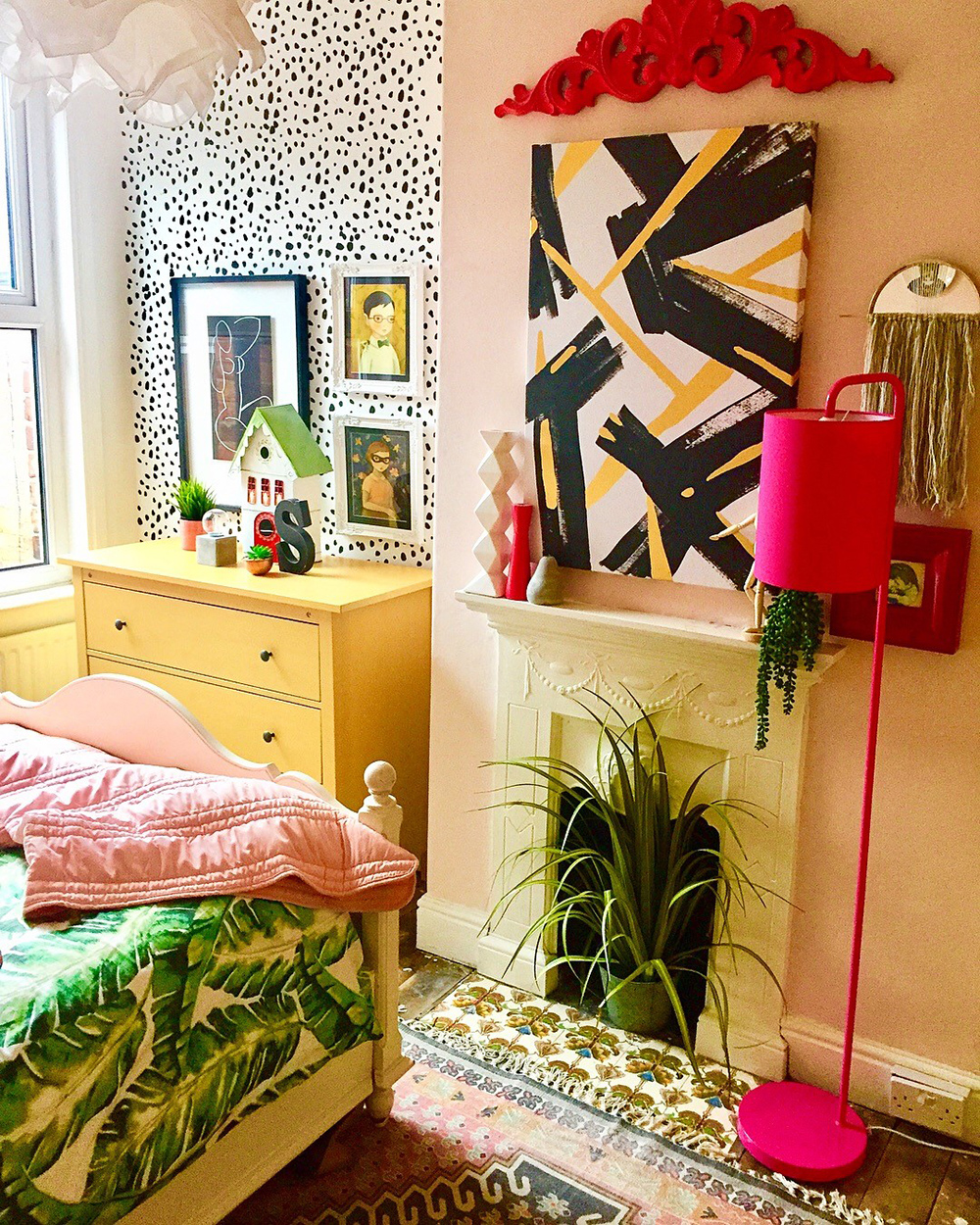 Colourful and fun bedroom with clashing patterns. 