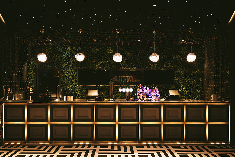 Charlton Hall - quirky wedding venue. Cool bar design with monochrome patterned floor.
