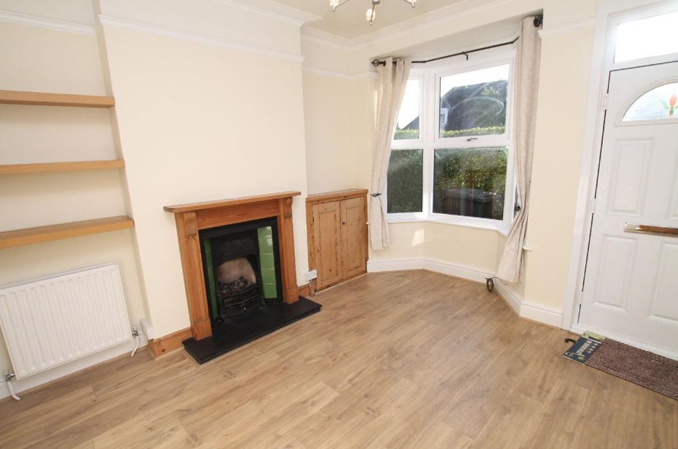 Before shot of Victorian living room.