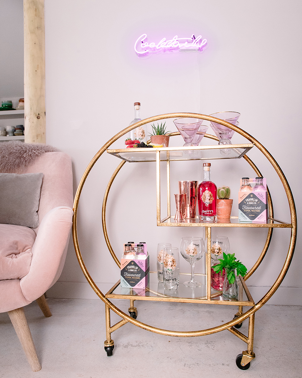 Pastel pink and neon gold drinks trolley styling. Trolley from Audenza