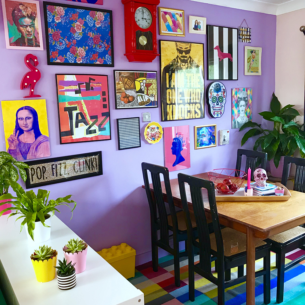 Gallery wall inspiration with quirky prints and lilac walls.