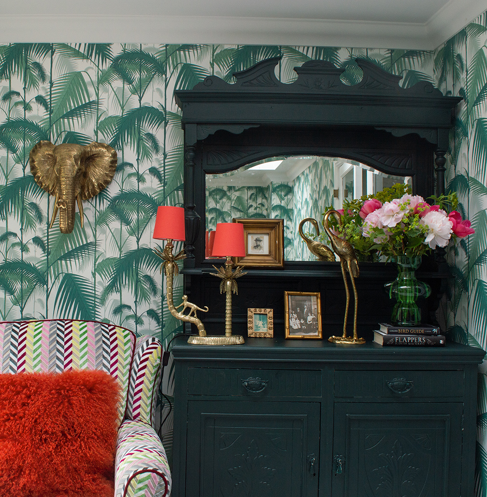 Green living room inspiration with tropical patterned wallpaper