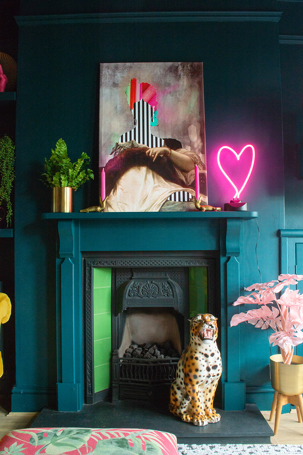 Eclectic living room inspiration. Teal walls paired with colourful art and quirky accessories.