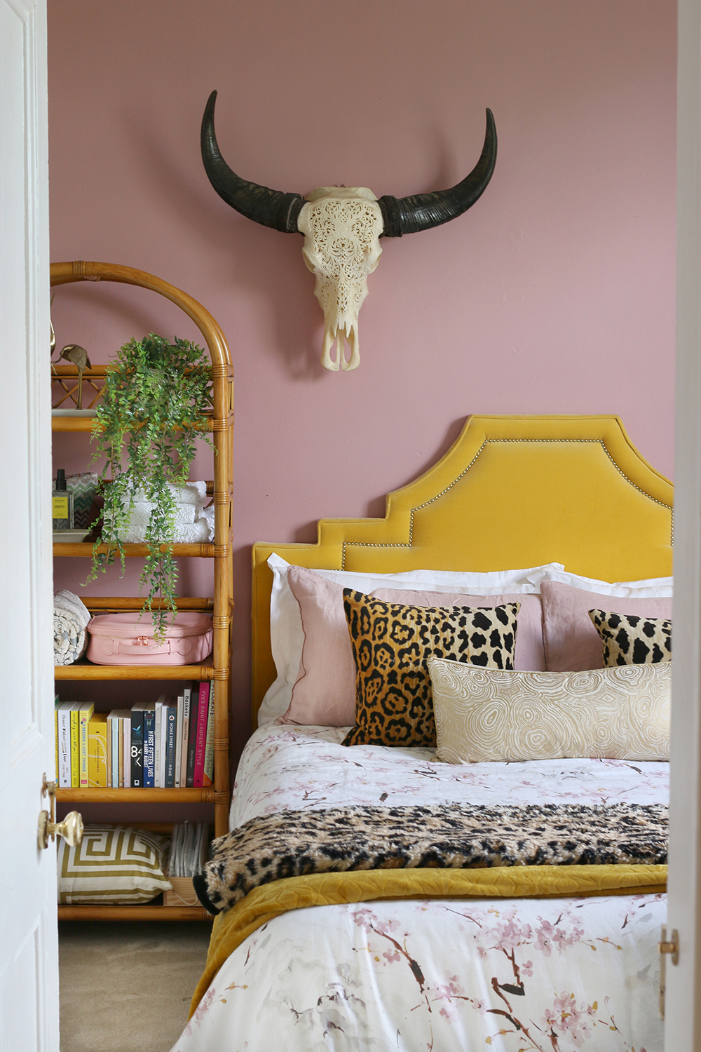 Blush pink bedroom with leopard print home accents
