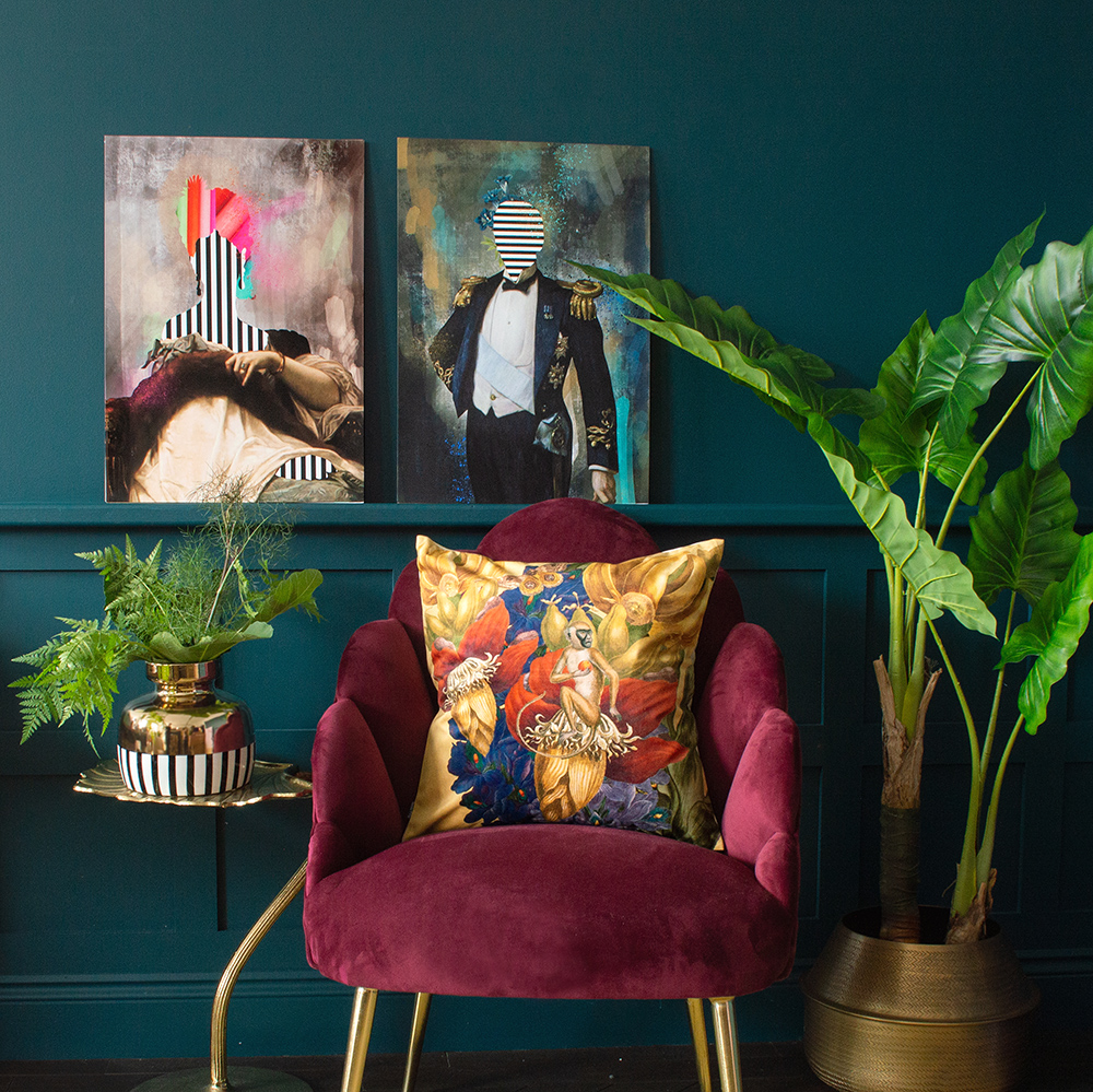 Cool, quirky prints. Moody, blue living room with unusual Duke and Duchess art prints.