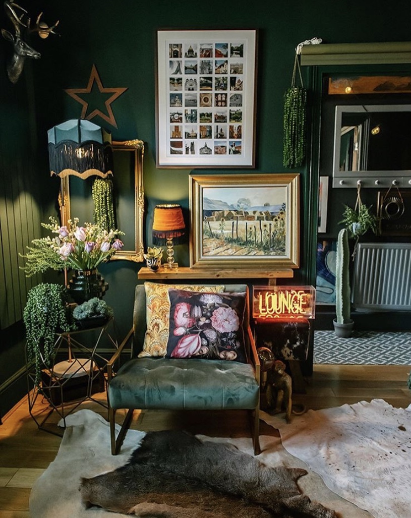 Maximalist living room decor. Our isla glass vase styled with lush faux greenery and green walls