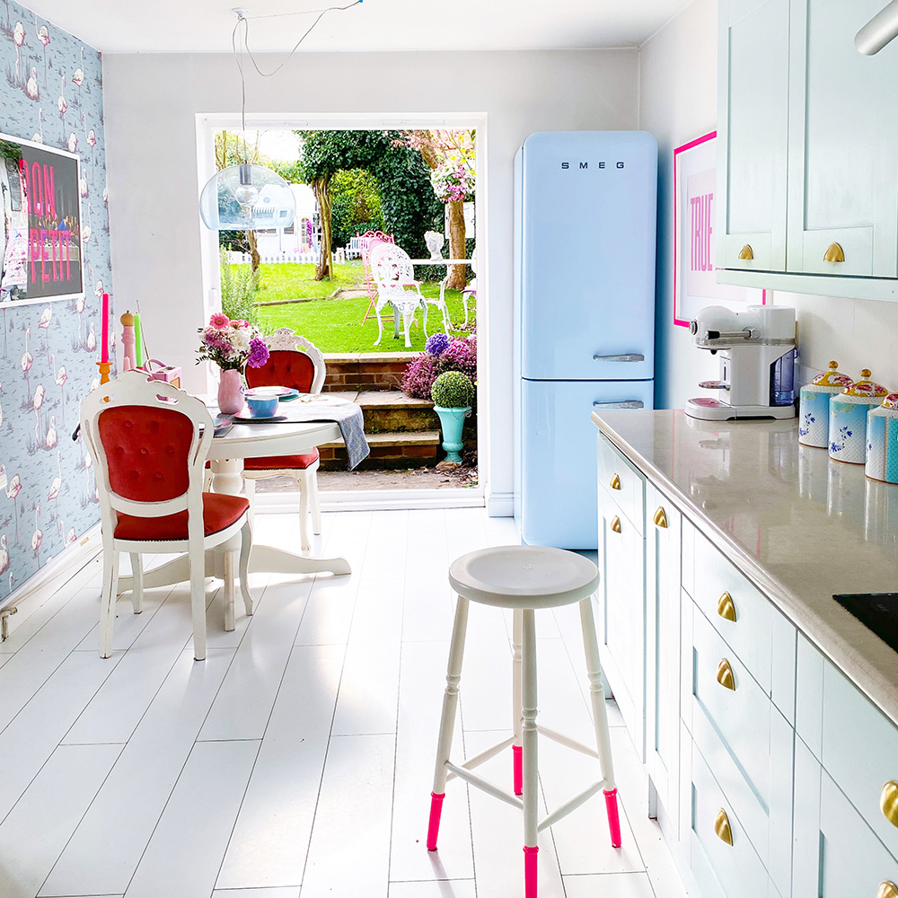 House tour of a fun family home - bright, fresh kitchen with pale blue cupboards and white floorboards