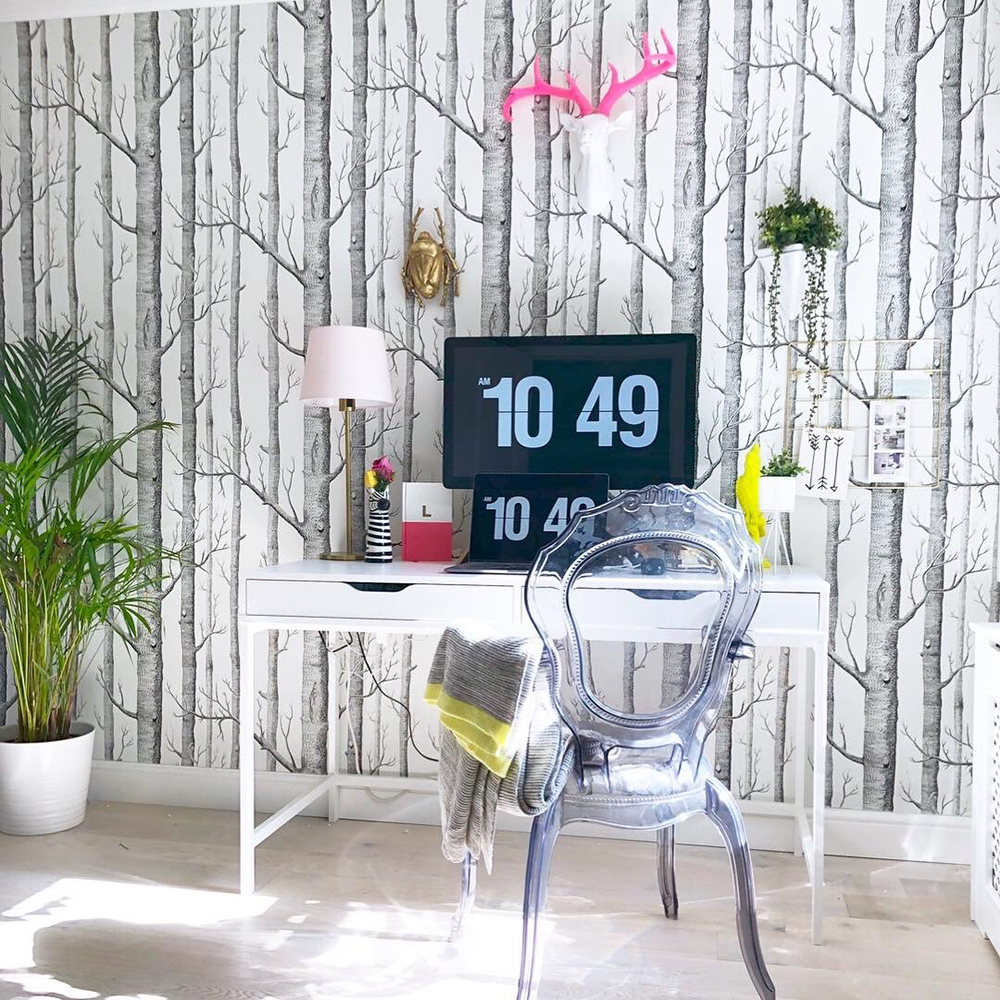 Home office with forest wallpaper