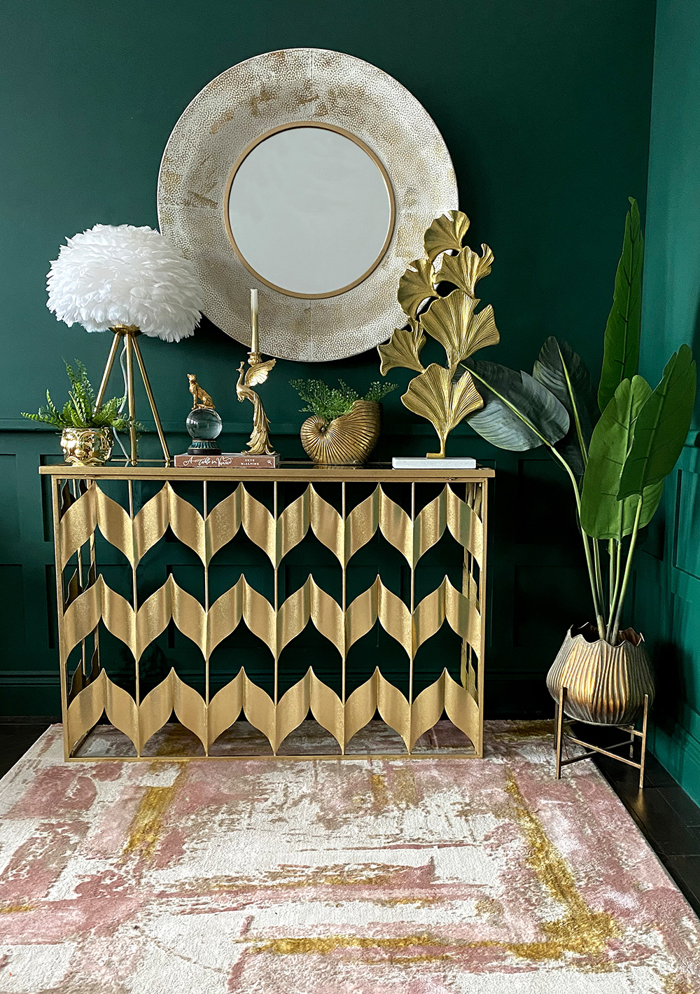 Glamorous, gold living room inspiration. Moody, dark green walls, paired with gold accessories and gold console table. All available at Audenza