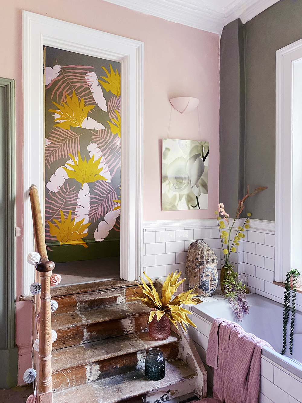 Blush pink bathroom with colourful wall murals