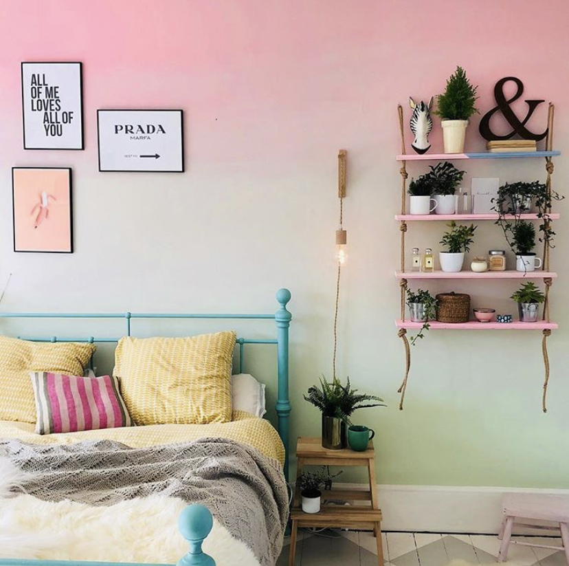 Pink and green ombre painted wall in the bedroom