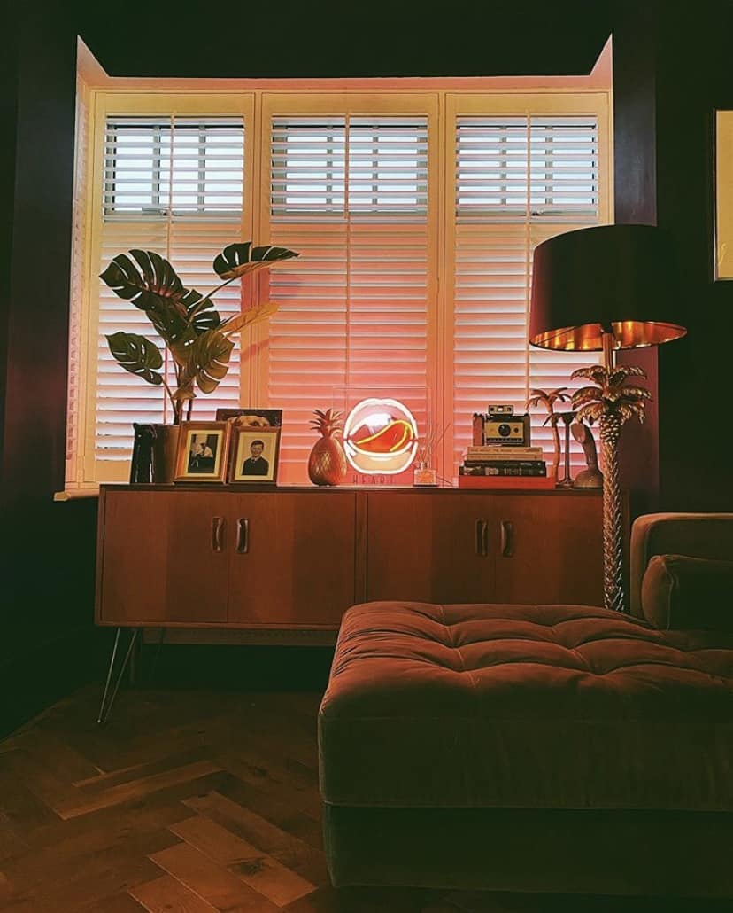Eclectic living room - quirky lighting styled on a mid-century sideboard