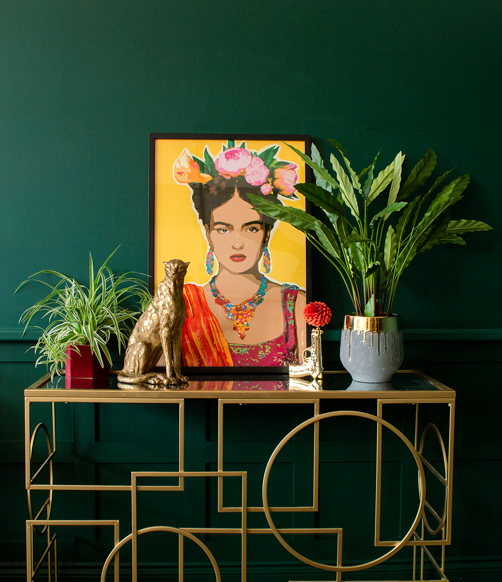 Colourful home decor. Quirky gold home accessories paired with colourful Frida style artwork