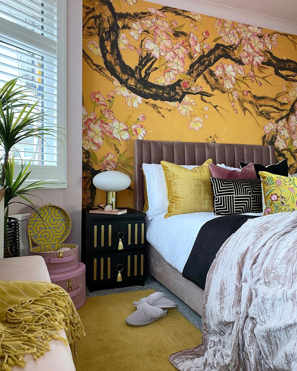 Bedroom decor inspiration with bold feature wall of yellow patterned wallpaper by Jo at Cloud Nine Interiors