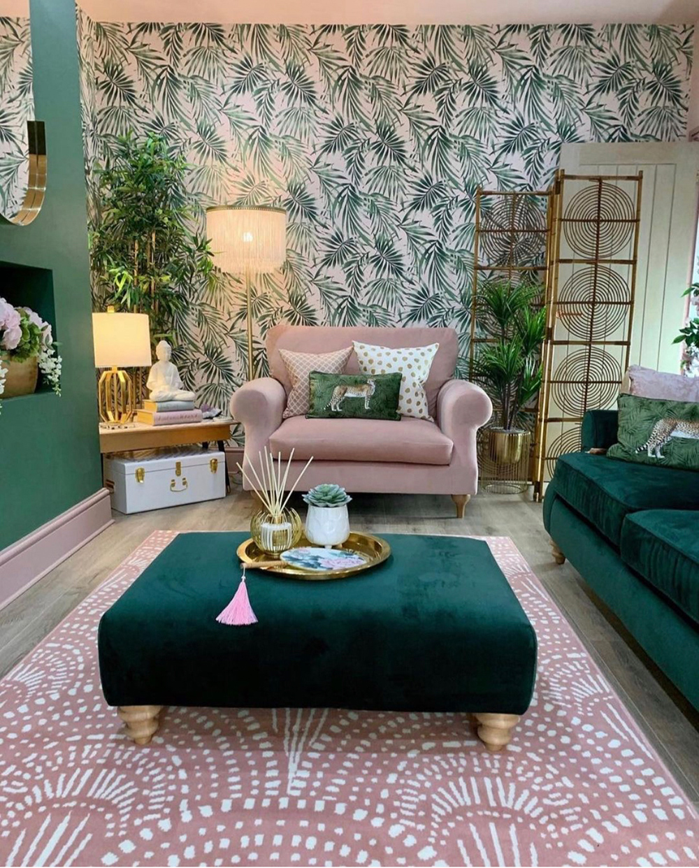 Pink and green tropical decor. Gorgeous green tropical palm leaf wallpaper, with pink and teal velvet sofas and pink patterned rug