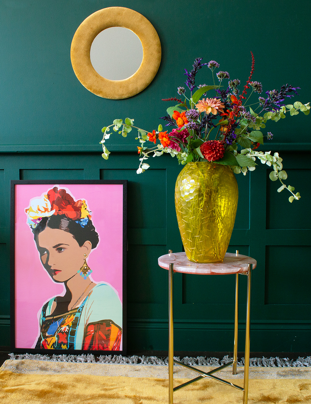 Frida Kahlo style artwork propped on the floor, perfect styling if you live in a rented house or flat