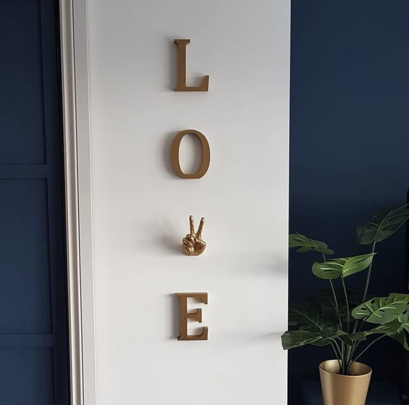 Love wall decor featuring our Gold Peace Hand Wall Decor