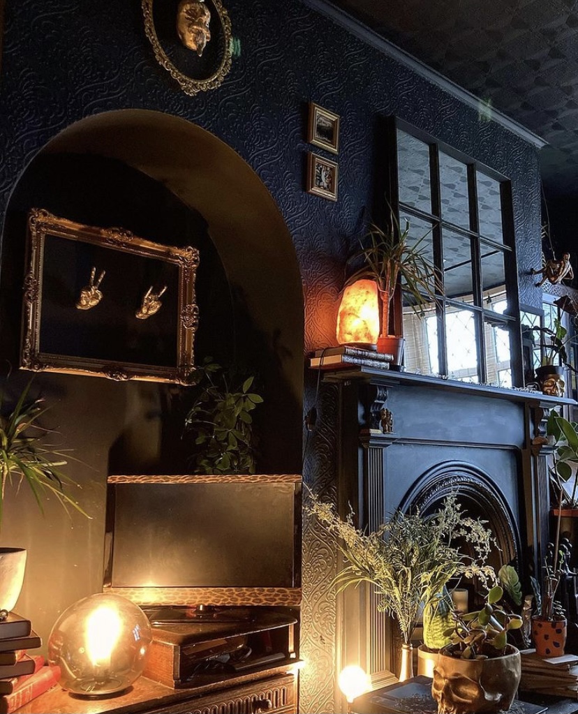 Black and moody living room featuring our Gold Peace Hand and Gold Rock On Hand Wall Decor