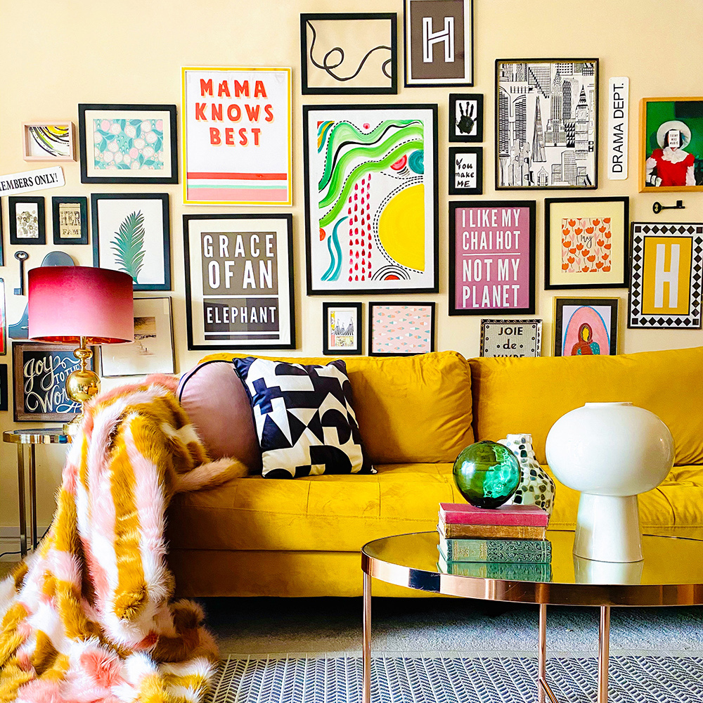 Quirky and colourful gallery wall with gorgeous mustard velvet sofa and colourful accessories.