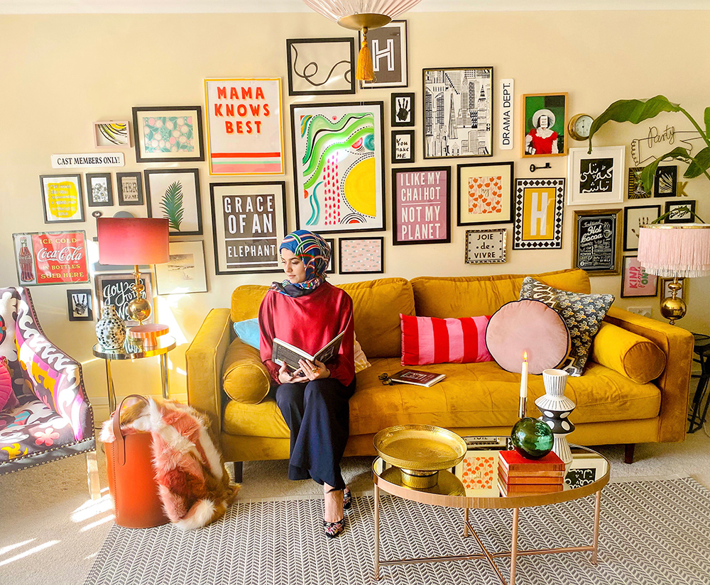 Quirky and colourful gallery wall with gorgeous mustard velvet sofa and colourful accessories.