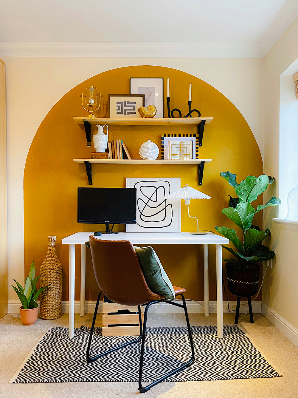 Home office decor with an unusual painted wall arch in mustard yellow. Renter friendly - painted over self-adhesive clear vinyl