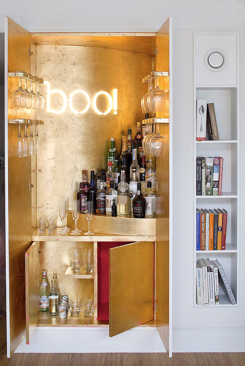 Cool home bar ideas - gold leaf bar built within a cupboard with an amazing BOO neon sign