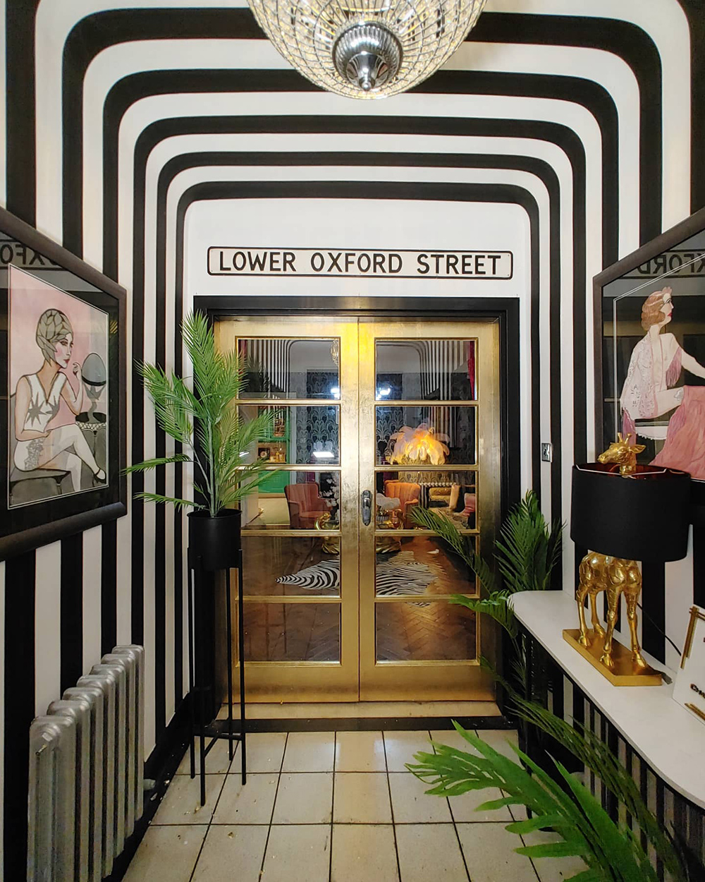 Siobhan Murphy's eclectic, home with gold foil doors by Bland Design and monochrome striped wallpaper