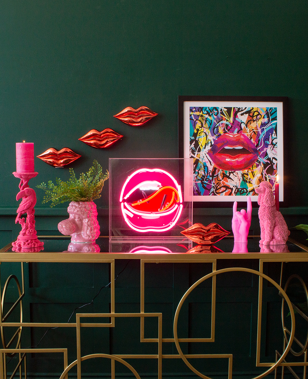 Colourful and quirky console table styling. Quirky pink flocked homewares with pink neon lips box light