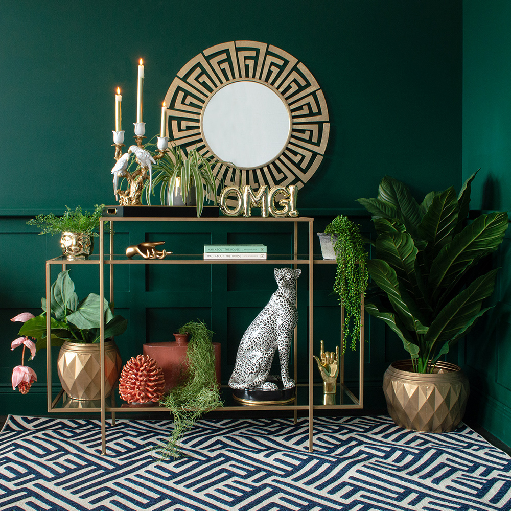 Moody green living room with colourful and quirky home accessories. We've styled our Gold OMG Balloon Ornament with an array of quirky homewares, including ourGreek Key Mirror, Lumi the Snow Leopard and White Lovebirds Candle Holder