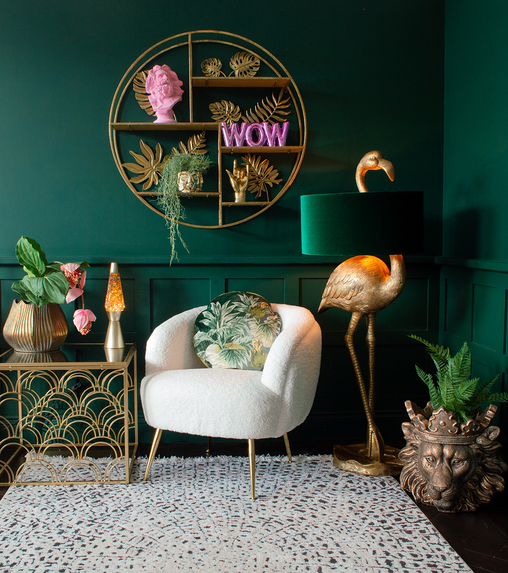 Moody green living room with colourful and quirky home accessories. We've styled our Pink Wow Balloon Ornament with an array of quirky homewares, including our Pink Flocked Marseillaise Bust, and Flamingo Floor Lamp